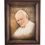 Viktor-Art A unique gift, Papież - Jan Paweł II - Totus Tuus is a framed 3D relief portraying the Pope in white robes, with the Latin phrase TOTUS TUUS on a bronze background, all set in a dark brown wood frame. Exclusive Woodcarving