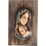 Viktor-Art The Matka Boska Maria z Dzieckiem Jezusem (Model 1) is a wooden handcrafted statue with a carved, painted relief of Mary in a blue veil gazing at baby Jesus—set against textured wood grain, making it an ideal gift for any occasion. Exclusive Woodcarving