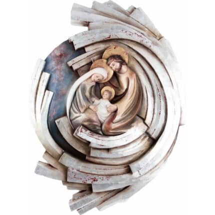Viktor-Art The “Święta Rodzina - Serce i Dom - Wir - Spirala (model 5) - Srebrny liść” is a handpainted relief sculpture of the Holy Family with halos, gentle expressions, and radiating abstract layers resembling white wooden beams. Exclusive Woodcarving