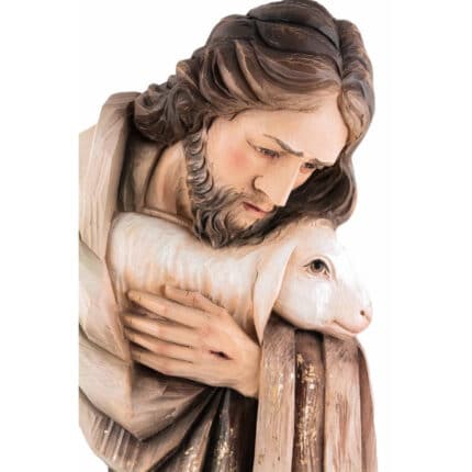 Viktor-Art The Dobry Pasterz (model 1) is a finely crafted wooden sculpture showing a serene, bearded man in a robe gently holding a lamb, making it an ideal decorative gift for any home. Exclusive Woodcarving